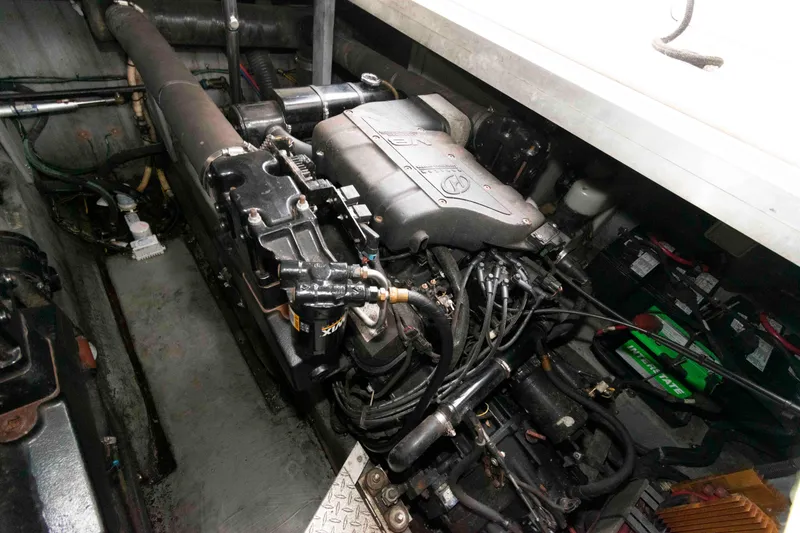 Slide: The Image of Engine compartment of a 1999 Sea Ray 370 Sundancer boat, showcasing mechanical components. - 21