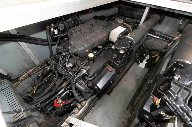 Slide: The Image of Engine compartment of a 1999 Sea Ray 370 Sundancer boat, showcasing mechanical components. - 22