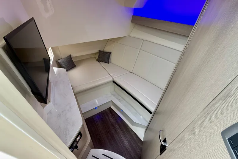 Slide: The Image of Luxurious interior of 2023 Scout 350 LXZ boat with modern seating and TV. - 21