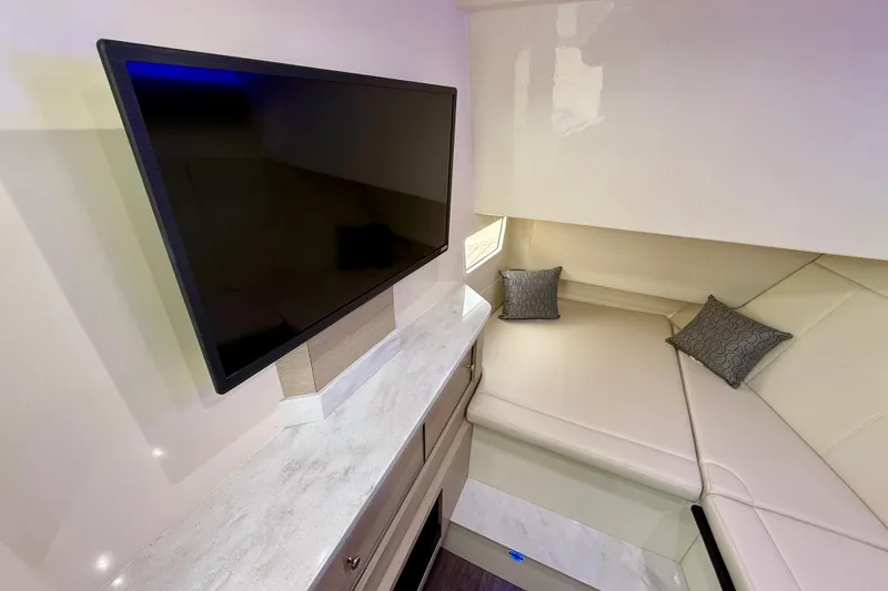 Slide: The Image of Interior of 2023 Scout 350 LXZ with TV and cozy seating area. - 22