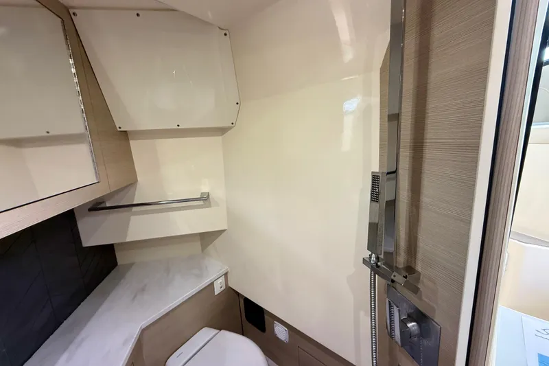Slide: The Image of 2023 Scout 350 LXZ boat bathroom with modern fixtures and sleek design. - 25