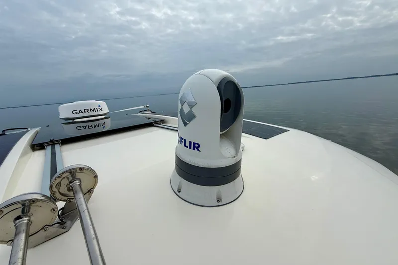 Slide: The Image of 2023 Scout 350 LXZ boat with Garmin and FLIR equipment on calm water. - 31