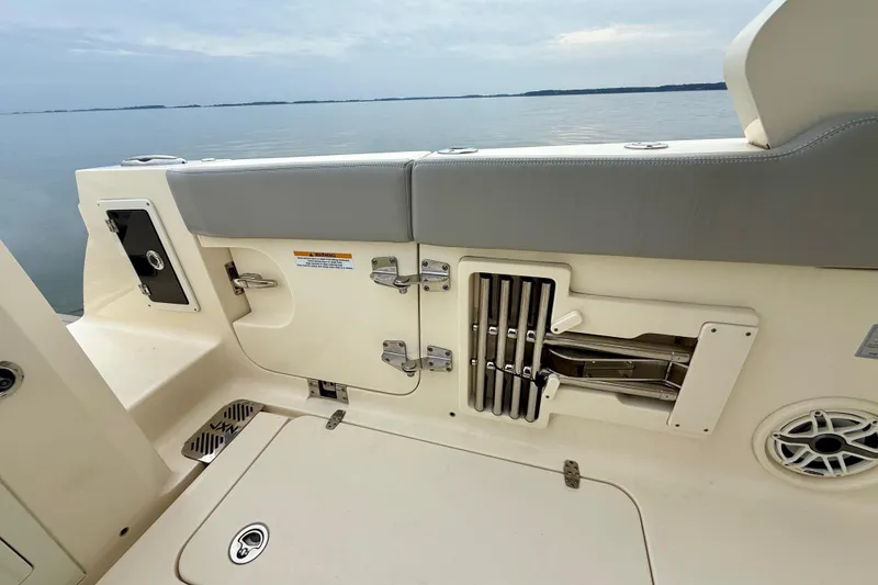 Slide: The Image of 2023 Scout 350 LXZ boat interior with storage compartments and seating. - 45