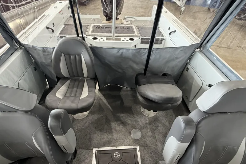 Slide: The Image of Interior of 2026 Hewescraft 221 Evolution boat with four gray seats. - 15