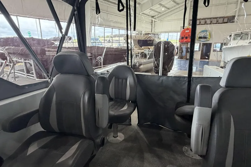 Slide: The Image of Interior of 2026 Hewescraft 221 Evolution boat with modern seating and spacious cabin. - 16
