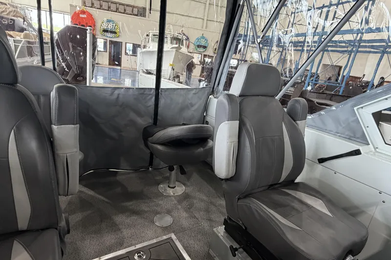 Slide: The Image of Interior of 2026 Hewescraft 221 Evolution boat with gray seating and modern design. - 17