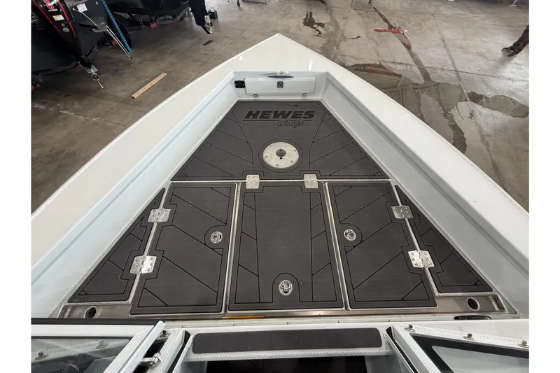 Slide: The Image of 2026 Hewescraft 221 Evolution boat deck with storage compartments. - 18