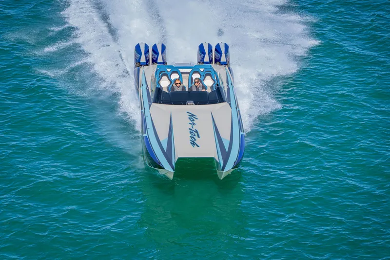 Slide: The Image of 2026 Nor-Tech 4000 Super Catamaran speeding on clear blue water. - 101