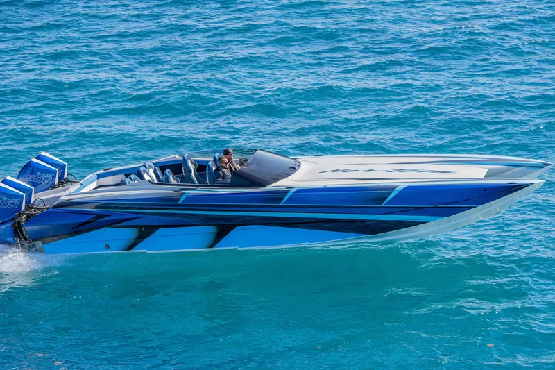 Slide: The Image of 2026 Nor-Tech 4000 Super Catamaran cruising on clear blue water. - 106