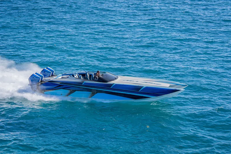 Slide: The Image of 2026 Nor-Tech 4000 Super Catamaran speeding on open water, showcasing sleek design. - 107