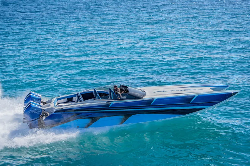 Slide: The Image of 2026 Nor-Tech 4000 Super Catamaran speeding on clear blue ocean waters. - 109