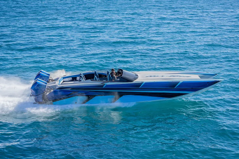 Slide: The Image of 2026 Nor-Tech 4000 Super Catamaran speeding on blue ocean waters. - 11