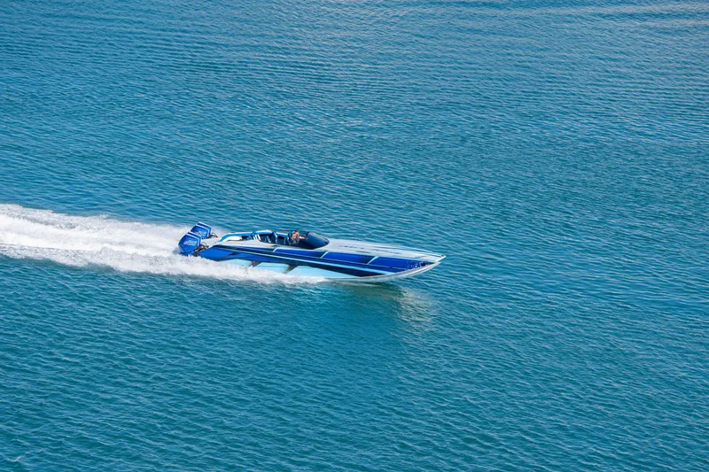 Slide: The Image of 2026 Nor-Tech 4000 Super Catamaran speeding on open water. - 117