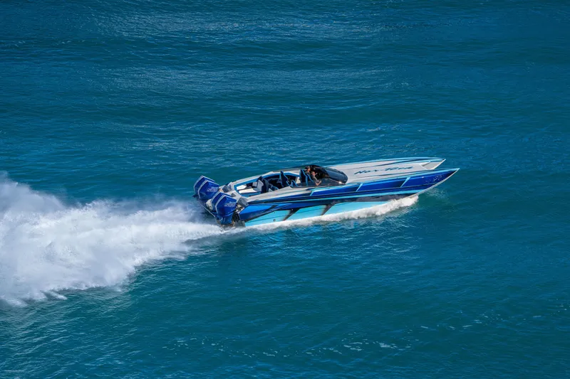 Slide: The Image of 2026 Nor-Tech 4000 Super Catamaran speeding on blue ocean waters. - 118