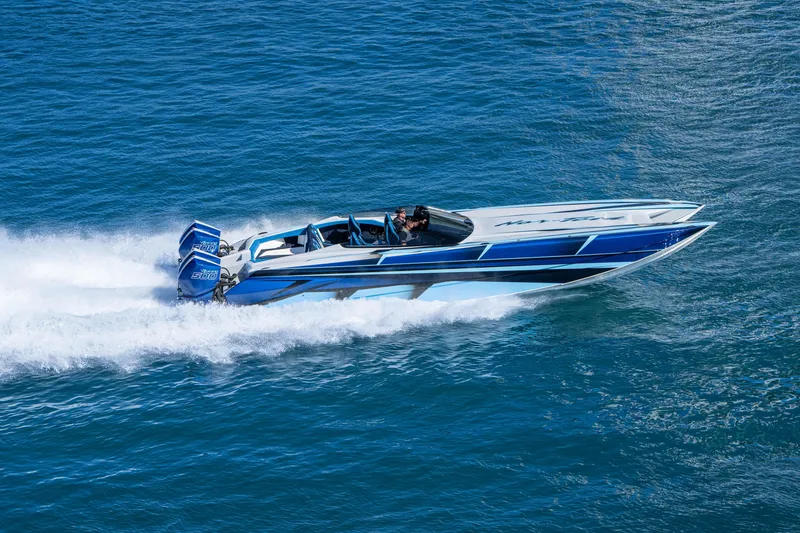 Slide: The Image of 2026 Nor-Tech 4000 Super Catamaran speeding on blue ocean waters. - 121
