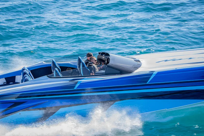 Slide: The Image of 2026 Nor-Tech 4000 Super Catamaran speeding on blue ocean waters. - 127