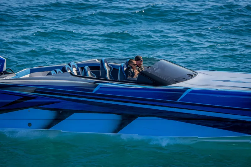 Slide: The Image of 2026 Nor-Tech 4000 Super Catamaran cruising on blue ocean waters. - 129