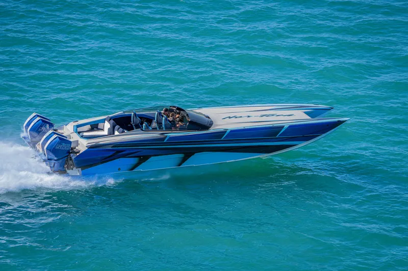 Slide: The Image of 2026 Nor-Tech 4000 Super Catamaran speeding on blue ocean waters. - 133