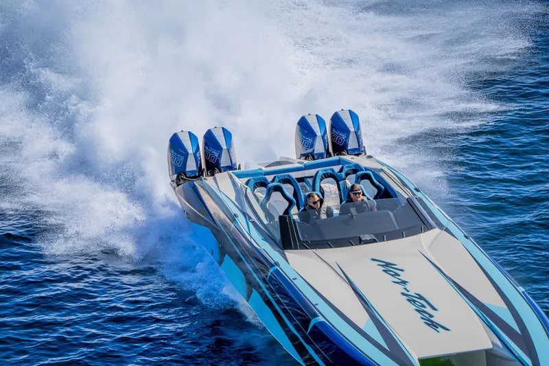 Slide: The Image of 2026 Nor-Tech 4000 Super Catamaran speeding on water with powerful engines. - 134