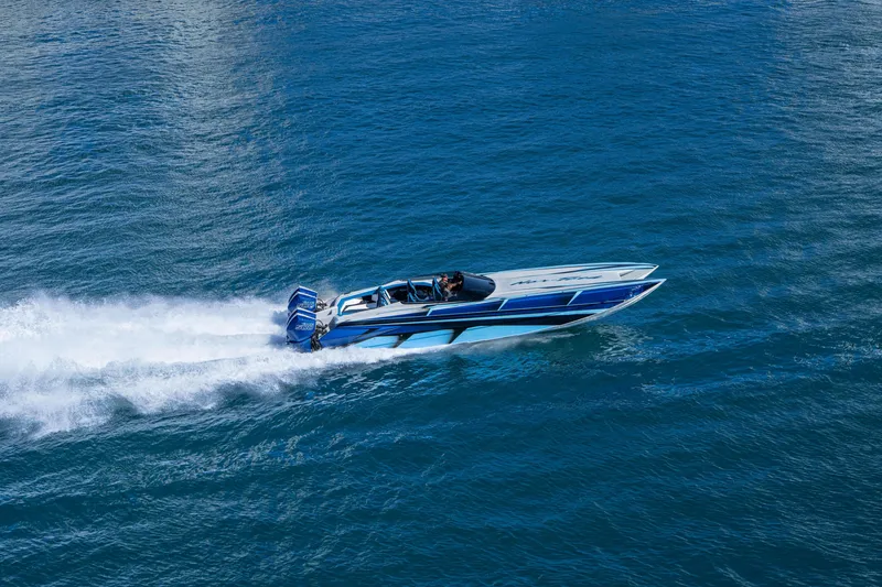 Slide: The Image of 2026 Nor-Tech 4000 Super Catamaran speeding on open water, showcasing sleek design and power. - 136