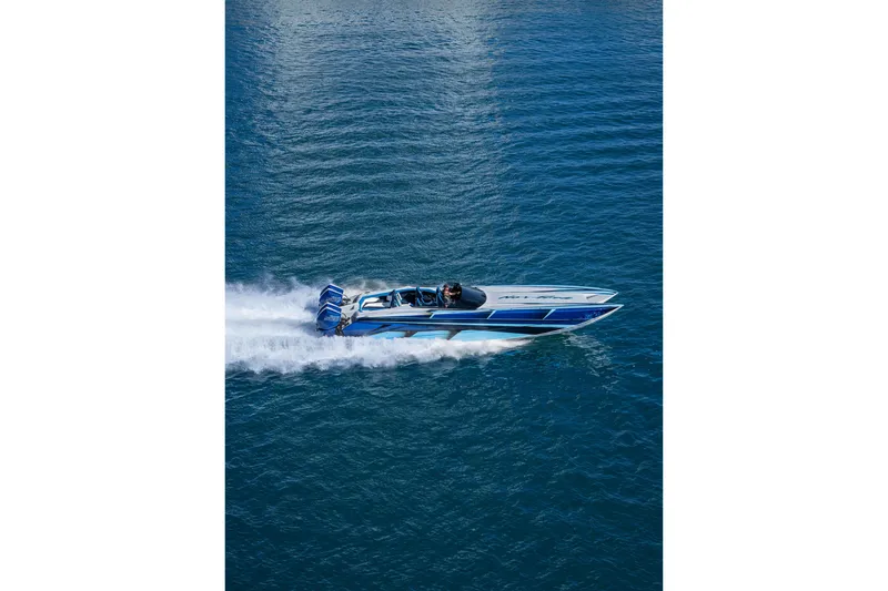 Slide: The Image of 2026 Nor-Tech 4000 Super Catamaran speeding on open water, showcasing sleek design. - 137