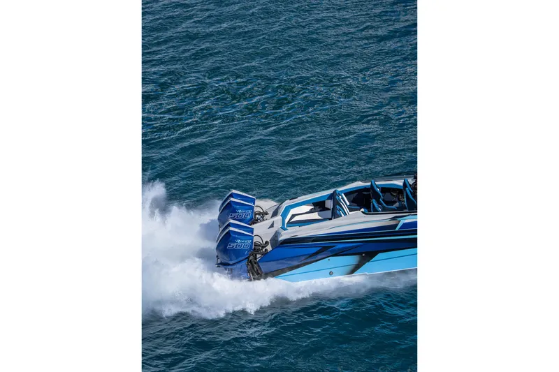 Slide: The Image of 2026 Nor-Tech 4000 Super Catamaran speeding on water, showcasing powerful engines. - 138