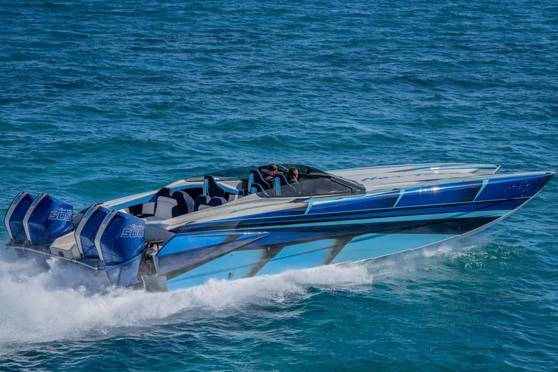 Slide: The Image of 2026 Nor-Tech 4000 Super Catamaran speeding on blue ocean waters. - 147