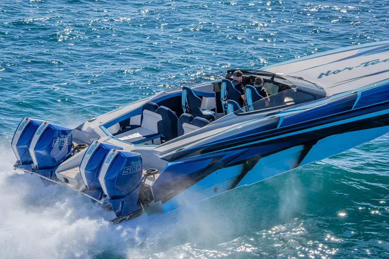 Slide: The Image of 2026 Nor-Tech 4000 Super Catamaran speeding on blue ocean waters. - 15