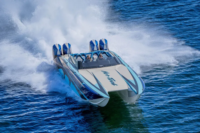 Slide: The Image of 2026 Nor-Tech 4000 Super Catamaran speeding on water, showcasing powerful performance and sleek design. - 151