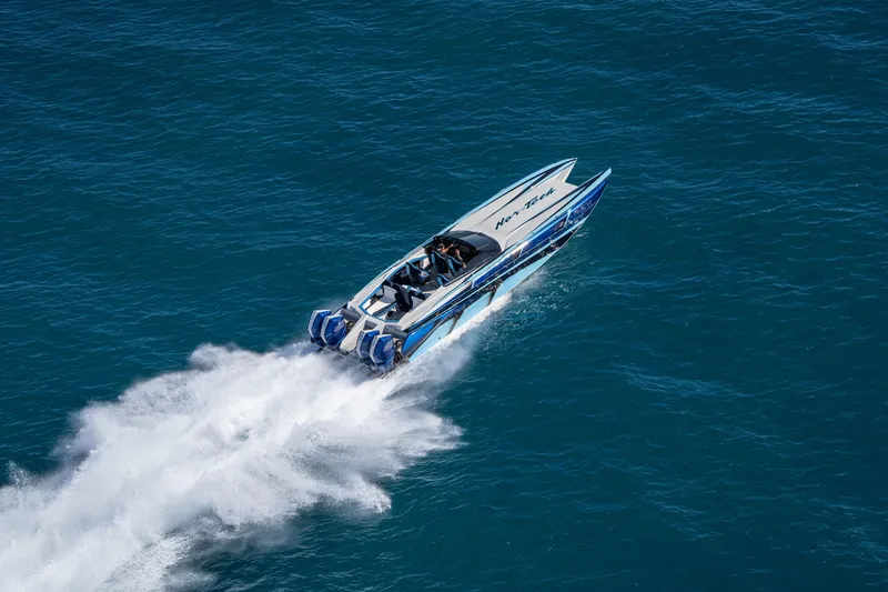 Slide: The Image of 2026 Nor-Tech 4000 Super Catamaran speeding on open water. - 154