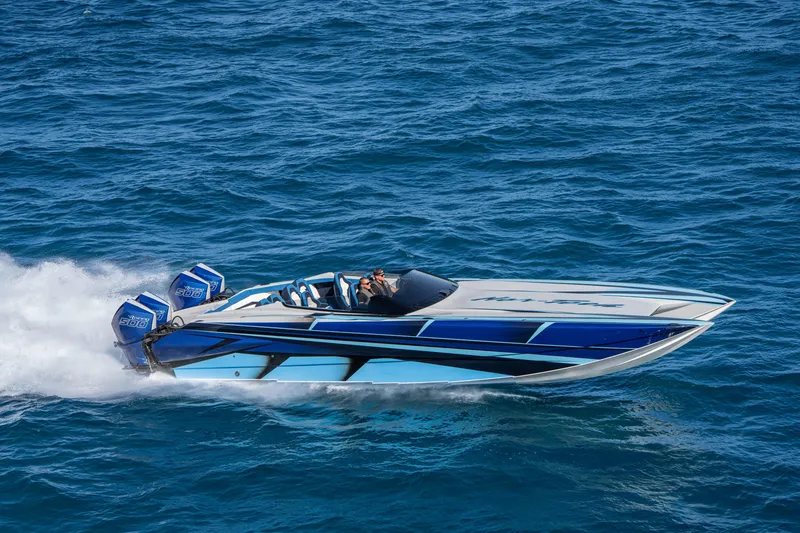 Slide: The Image of 2026 Nor-Tech 4000 Super Catamaran speeding on open water, showcasing sleek design. - 155