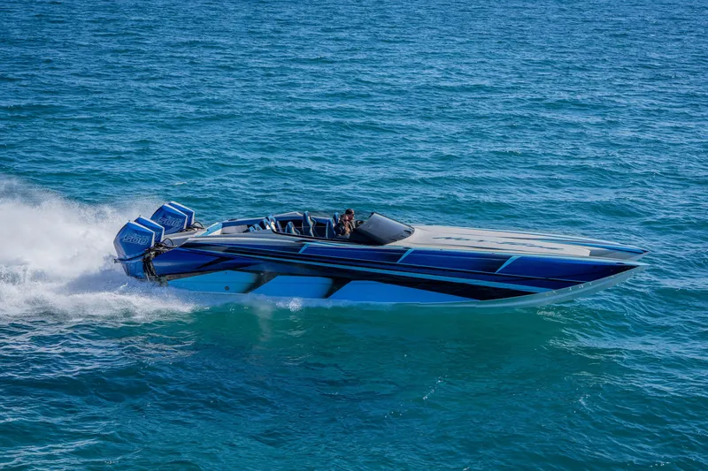 Slide: The Image of 2026 Nor-Tech 4000 Super Catamaran speeding on open water, showcasing sleek design. - 16