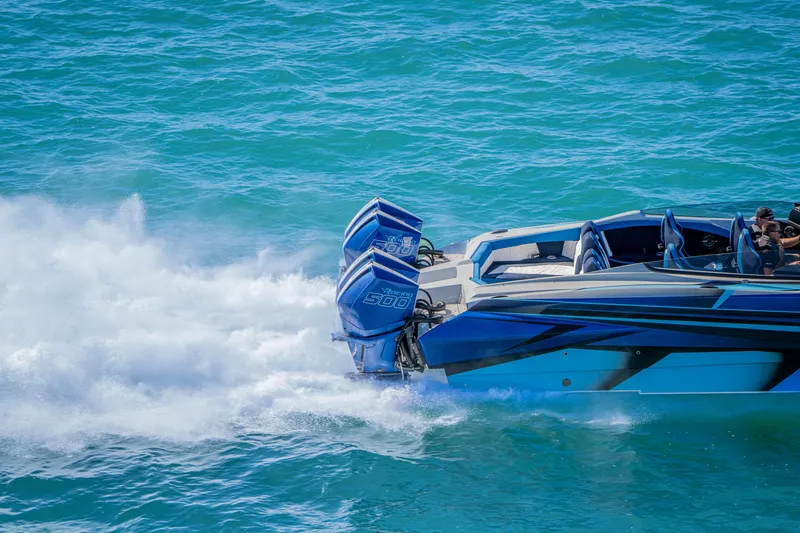 Slide: The Image of 2026 Nor-Tech 4000 Super Catamaran speeding on blue ocean waters. - 160