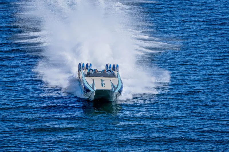 Slide: The Image of 2026 Nor-Tech 4000 Super Catamaran speeding on open water, creating a dramatic wake. - 165