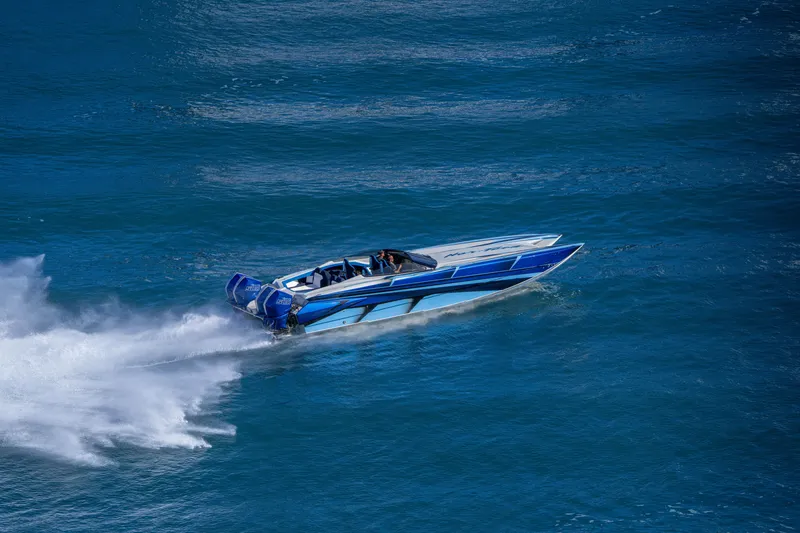 Slide: The Image of 2026 Nor-Tech 4000 Super Catamaran speeding on blue ocean waters. - 169