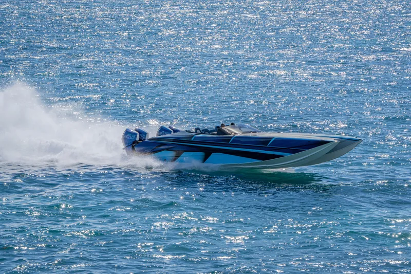 Slide: The Image of 2026 Nor-Tech 4000 Super Catamaran speeding on sparkling blue water. - 17