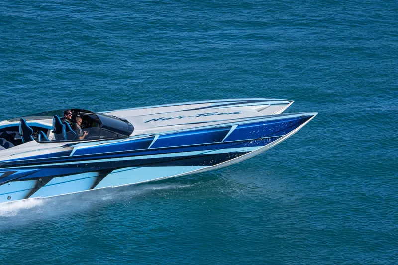 Slide: The Image of 2026 Nor-Tech 4000 Super Catamaran cruising on blue ocean waters. - 171