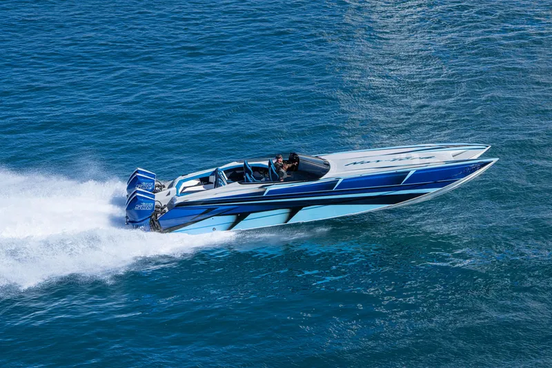 Slide: The Image of 2026 Nor-Tech 4000 Super Catamaran speeding on blue ocean waters. - 172