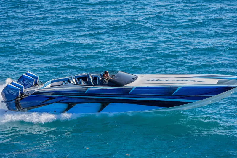 Slide: The Image of 2026 Nor-Tech 4000 Super Catamaran cruising on blue ocean waters. - 175