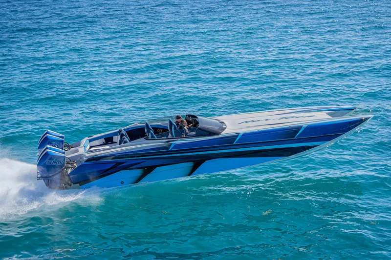 Slide: The Image of 2026 Nor-Tech 4000 Super Catamaran speeding on clear blue ocean waters. - 176