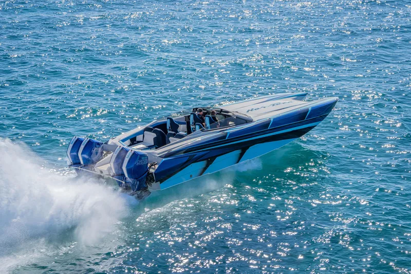 Slide: The Image of 2026 Nor-Tech 4000 Super Catamaran speeding on sparkling blue water. - 177