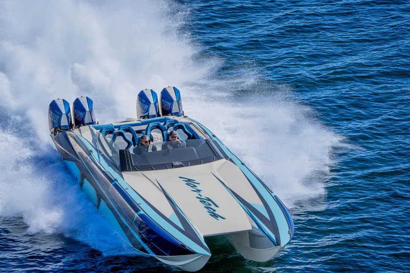 Slide: The Image of 2026 Nor-Tech 4000 Super Catamaran speeding on open water, showcasing powerful performance. - 182