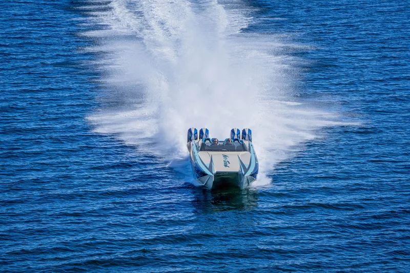 Slide: The Image of 2026 Nor-Tech 4000 Super Catamaran speeding on open water, creating a dramatic wake. - 196