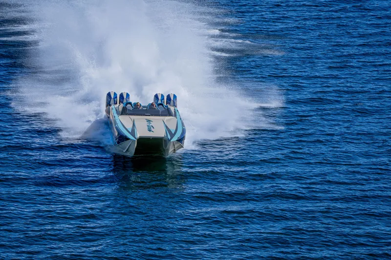 Slide: The Image of 2026 Nor-Tech 4000 Super Catamaran speeding on open water, creating a dramatic wake. - 197