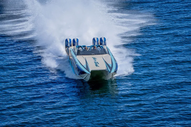 Slide: The Image of 2026 Nor-Tech 4000 Super Catamaran speeding on open water, creating a dynamic wake. - 198