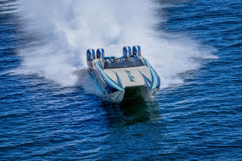 Slide: The Image of 2026 Nor-Tech 4000 Super Catamaran speeding on open water, creating a dramatic wake. - 199