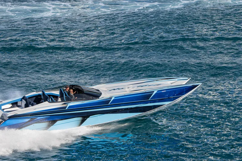 Slide: The Image of 2026 Nor-Tech 4000 Super Catamaran cruising on open water, showcasing sleek design and speed. - 204
