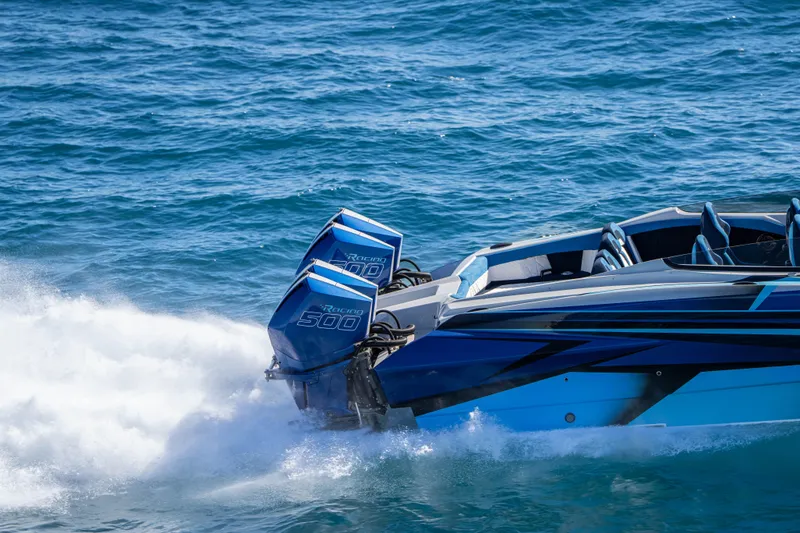 Slide: The Image of 2026 Nor-Tech 4000 Super Catamaran speeding on blue ocean waters. - 206