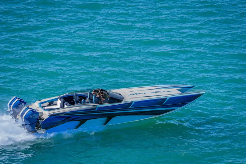 Slide: The Image of 2026 Nor-Tech 4000 Super Catamaran speeding on blue ocean waters. - 213