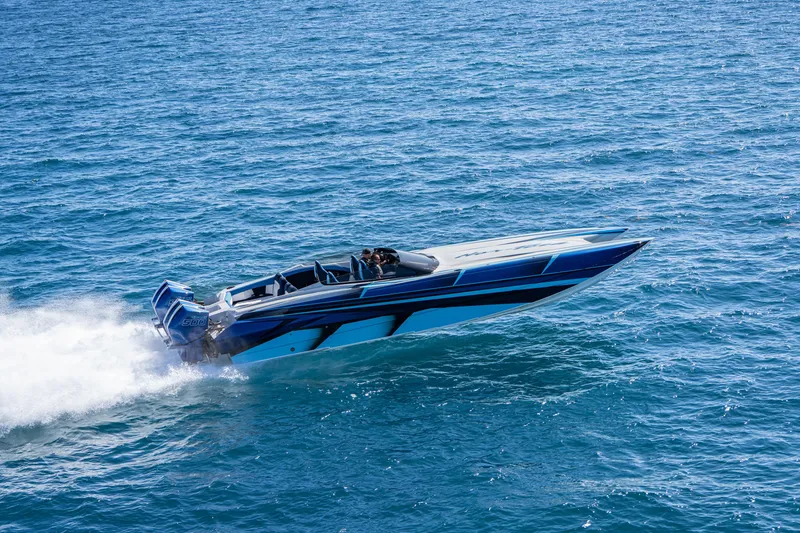 Slide: The Image of 2026 Nor-Tech 4000 Super Catamaran speeding on open water, showcasing sleek design. - 23